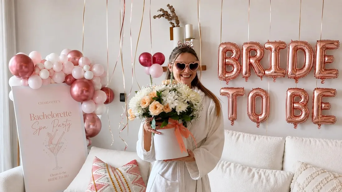 Bride-to-be with flowers at a Vita bachelorette spa party